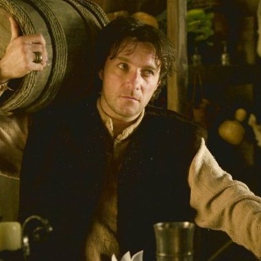 Alain CHAPUIS - A man from the Middle Ages in a tavern with a barrel on his shoulder