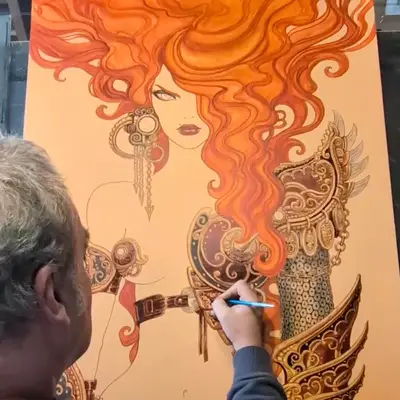 Olivier Ledroit travaille sur une illustration d'une femme aux cheveux roux ondulés, portant une armure ornée. L'affiche de Trolls et Légendes 2026 prend vie.